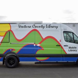 VCL's new Mobile Library - a large white van with a very large card logo